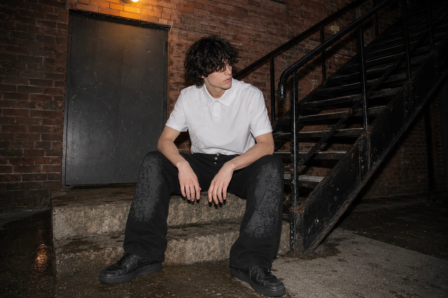 Victorian Crest Polo and Midnight Sweats worn on a nighttime staircase